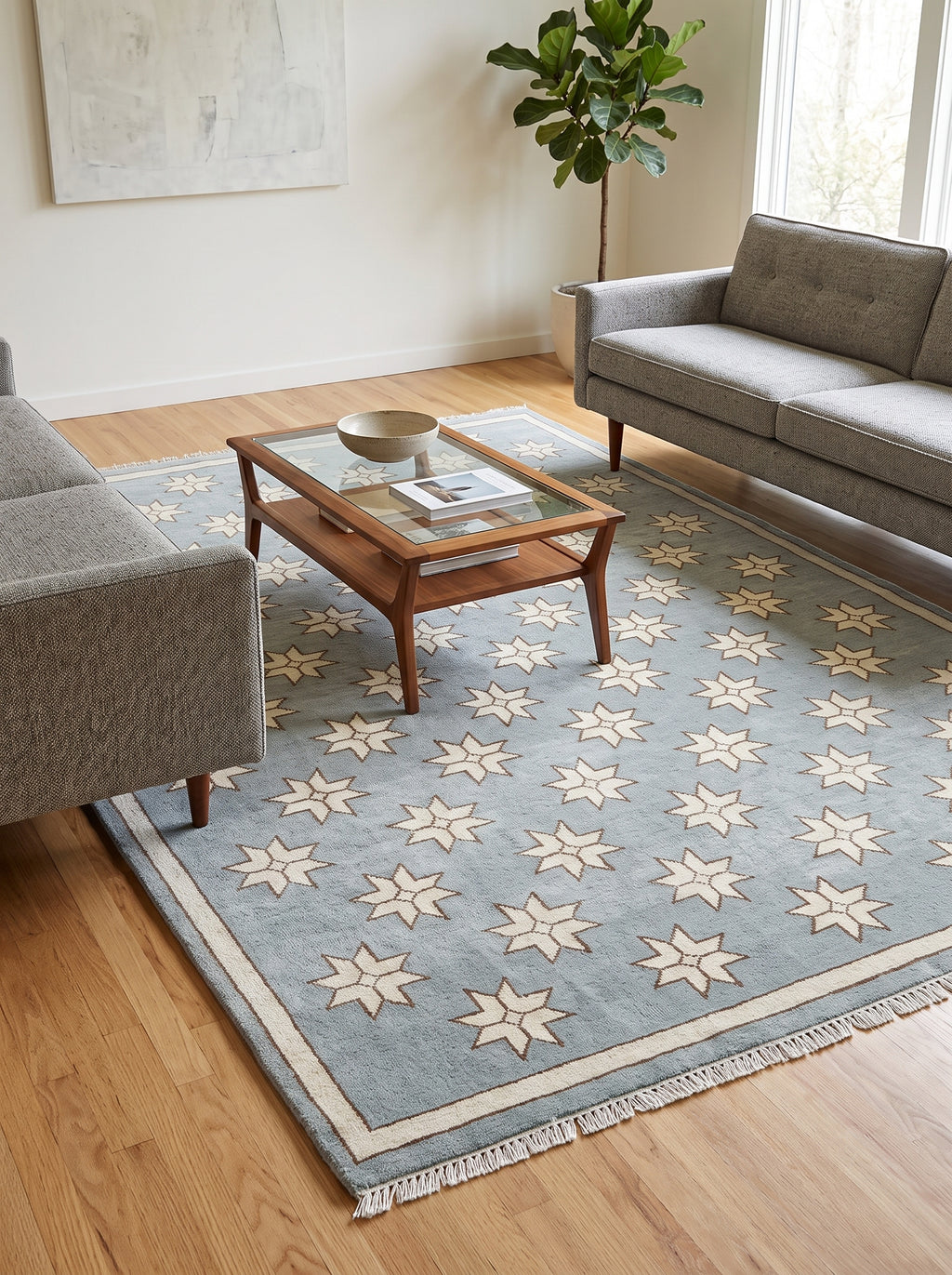 Close-up of cream star pattern on blue handmade wool rug