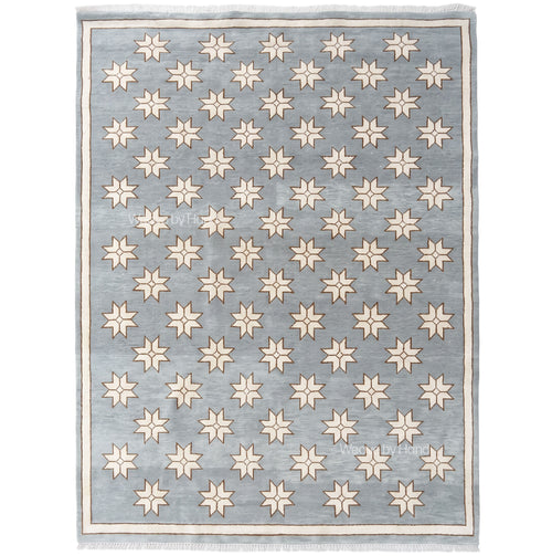 Gray Blue handwoven star rug with cream pattern and fringe on white background